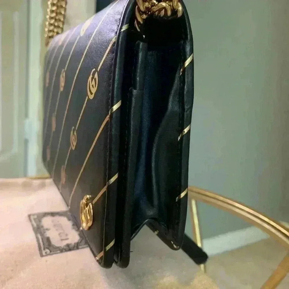 Gucci mini leather chain bag with double G stripe in black and gold. - Picture 6 of 14